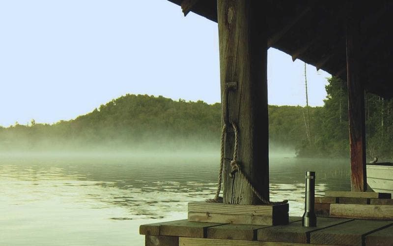 Exhibition stall showing industrial machinery with visitors